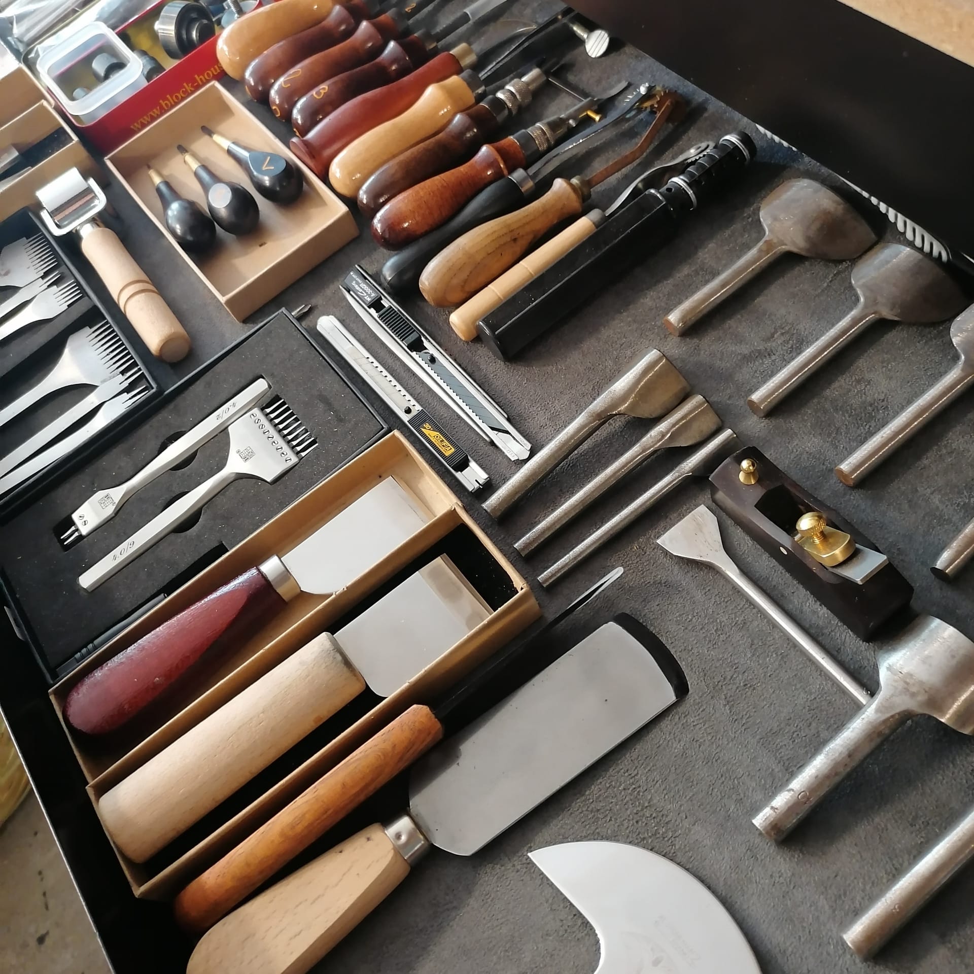 Traditional leatherworking tools in the atelier